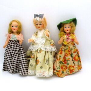 Set Of 3 Vintage 8" Plastic Celluloid Dolls With Floral & Checkered Dresses & 1